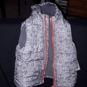 Chic Gray Puffer Vest with Vibrant Orange Zipper